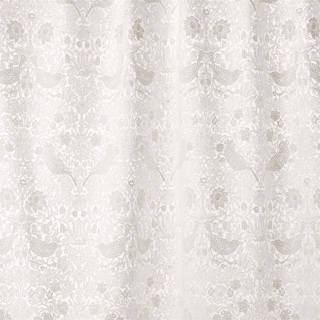 Paper-white fabric with dove-grey peacocks, flowers and scrolling botanical embroidery