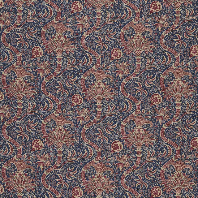Deep indigo floral scrolls with red, cream and olive motifs on a textured ground