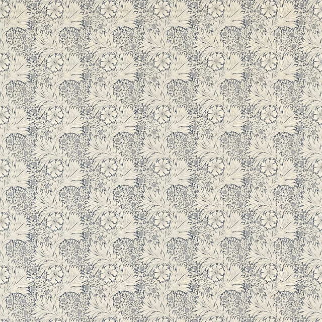 Ivory botanical fabric with densely repeated muted indigo flowers and leaves