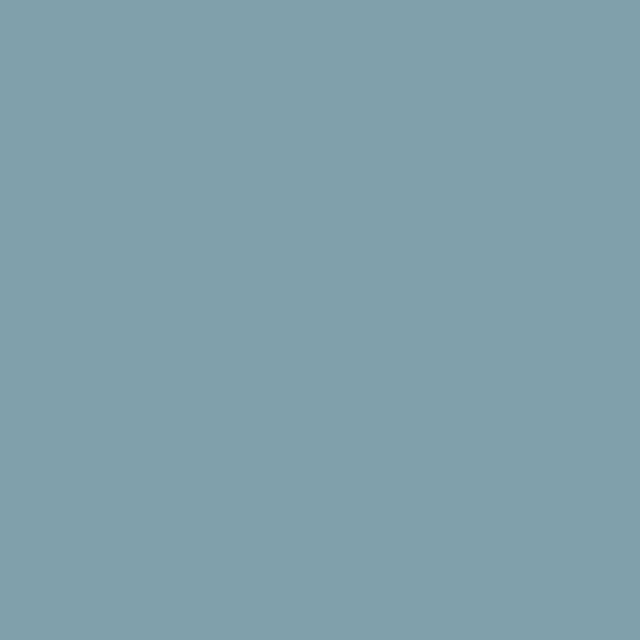 a flat tile of muted blue-green paint