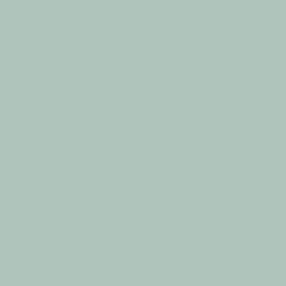 a flat tile of muted blue-green paint