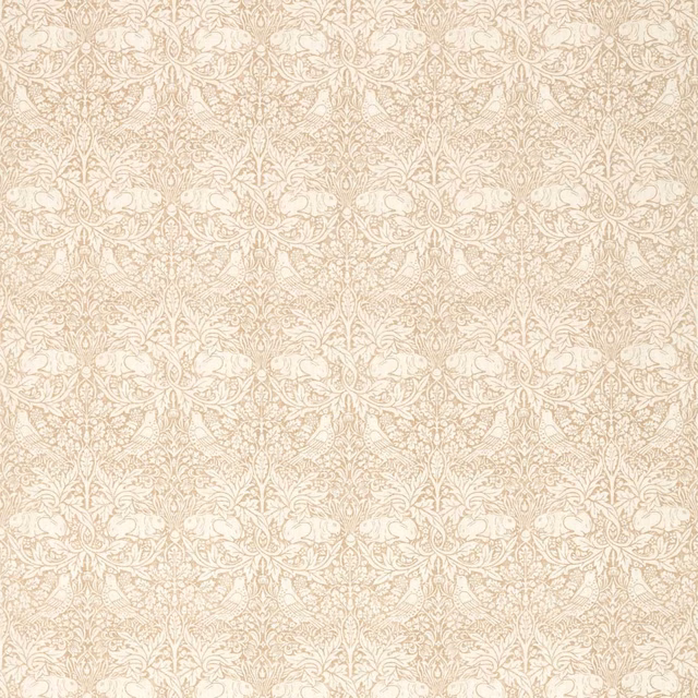 Pale flax-beige fabric with cream rabbits, scrolling leaves and dense botanical pattern