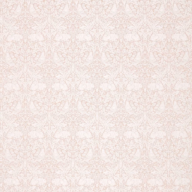 Faded sea-pink floral scrolls woven over a pale ivory ground
