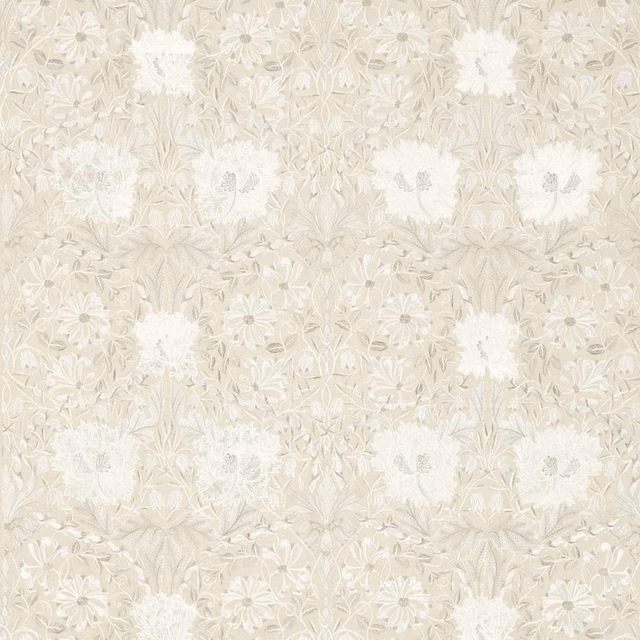 Warm ivory embroidered linen with chalk-white blooms and pale taupe trailing foliage