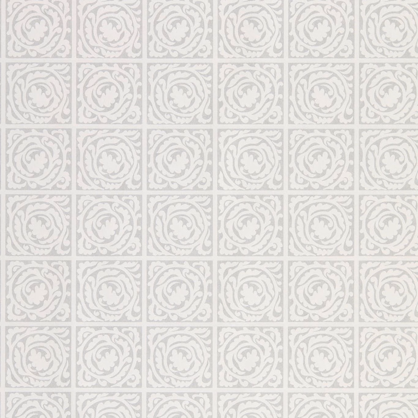 Light grey wallpaper with repeating pale scroll medallions in square panels