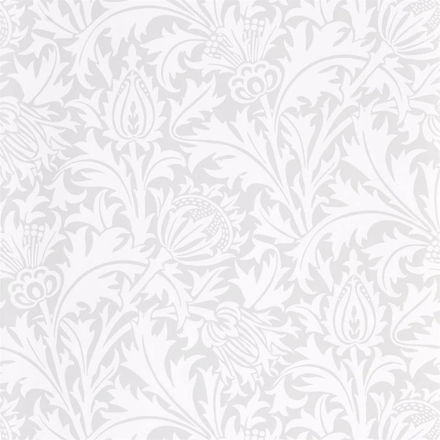 Pale grey-blue botanical wallpaper with white scrolling leaves and stylised flowers