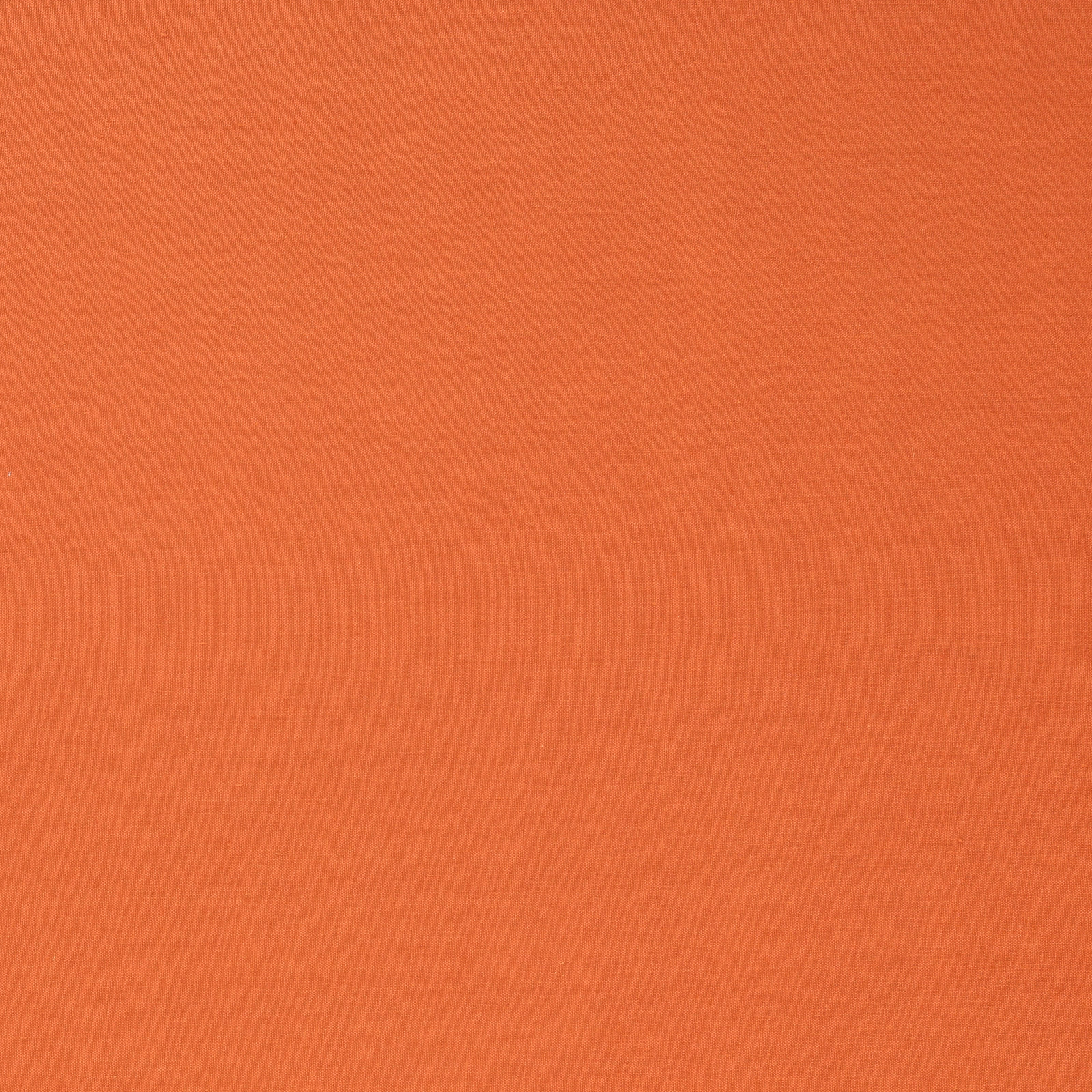 Close-up of warm paprika terracotta plain weave with subtle horizontal texture