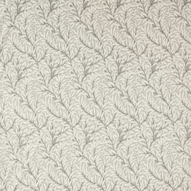 Close view of pale grey willow boughs on a finely textured light ground