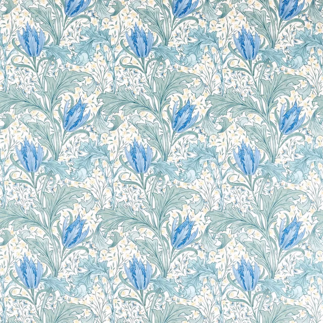 Cornflower-blue flower heads and pale aqua leaves on an ivory botanical fabric