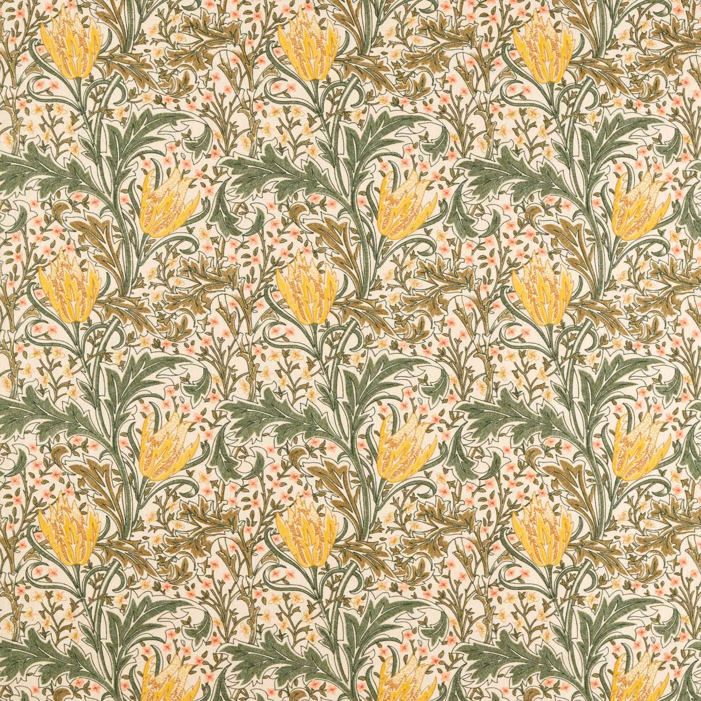Dense artichoke-green and weld-yellow floral embroidery over a warm ivory ground