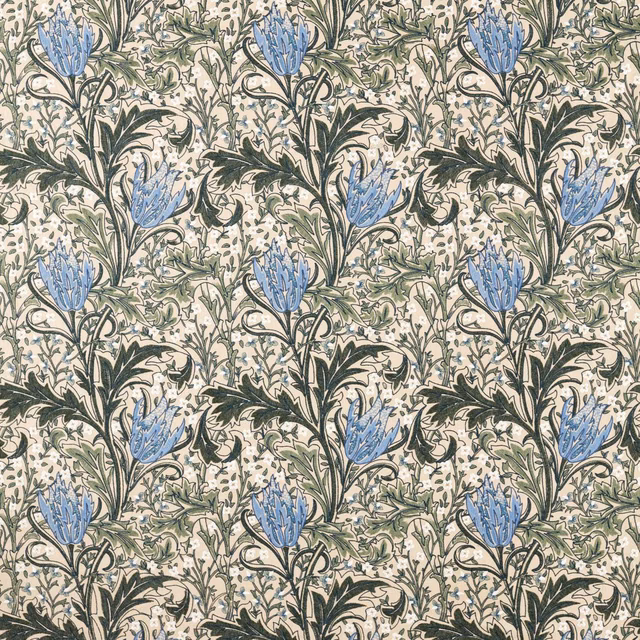 Cream-ground floral fabric with forest foliage and cornflower-blue lily heads