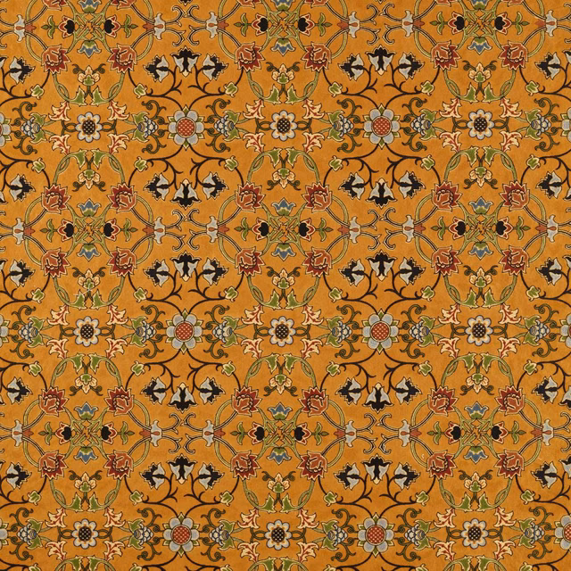 Burnished ochre textile with scrolling vines, floral medallions and black accents