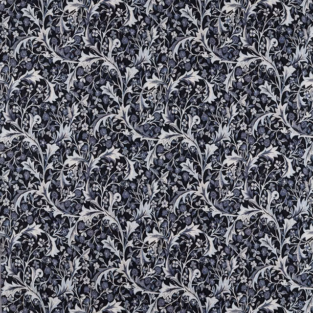Dense indigo woven fabric with pale grey botanical vines, leaves and curling flowers
