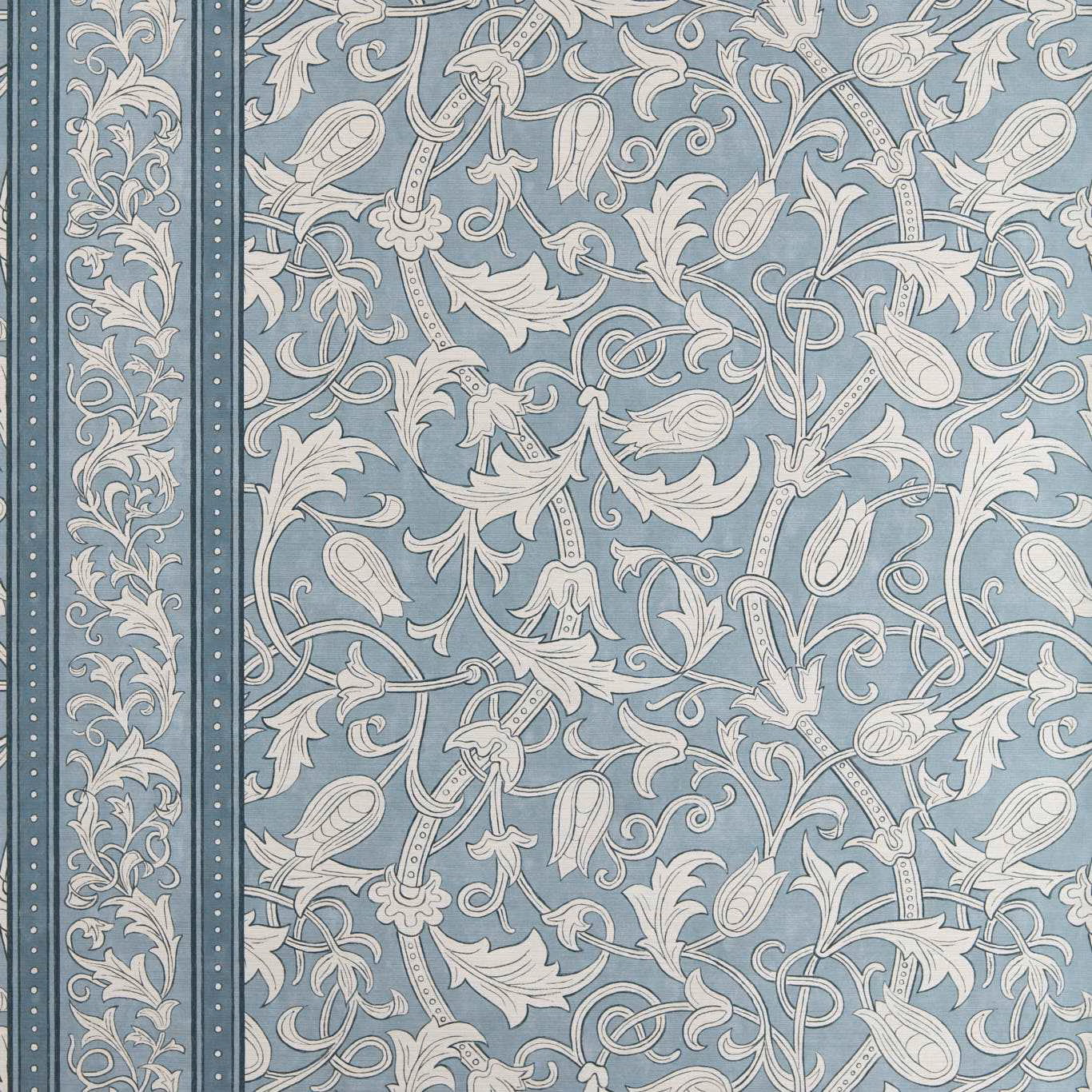 Faded blue-grey wallpaper with ivory scrolling tulips, foliage and a narrow floral border