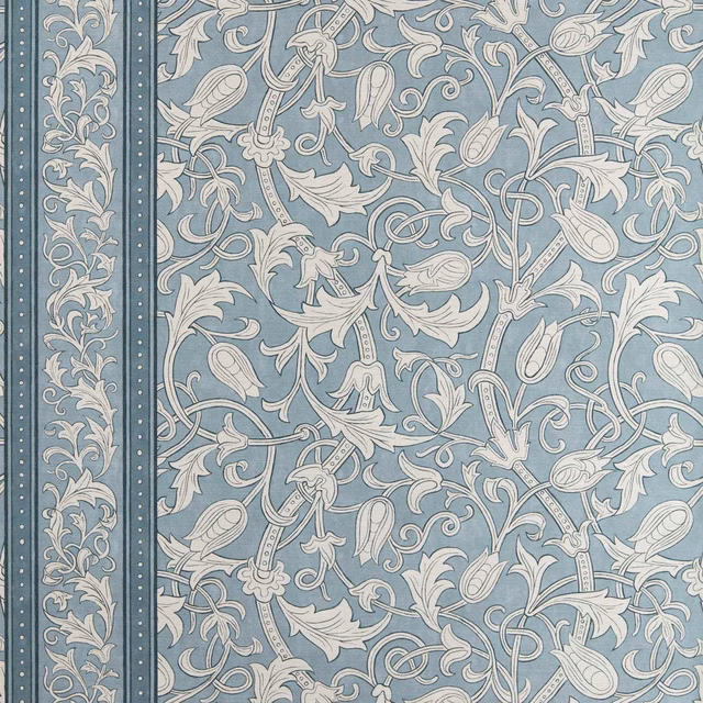 Faded blue-grey wallpaper with ivory scrolling tulips, foliage and a narrow floral border