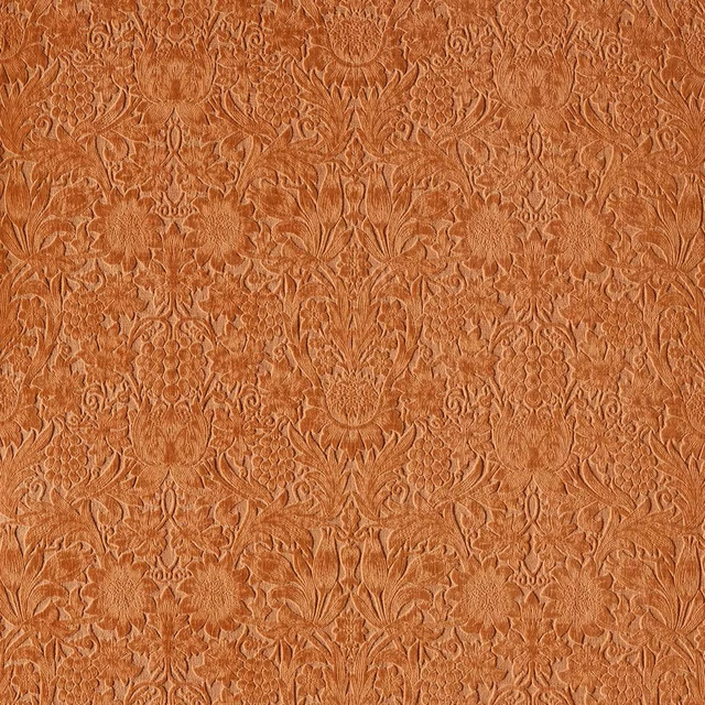 Warm terracotta velvet with intricate symmetrical damask and softly shifting pile