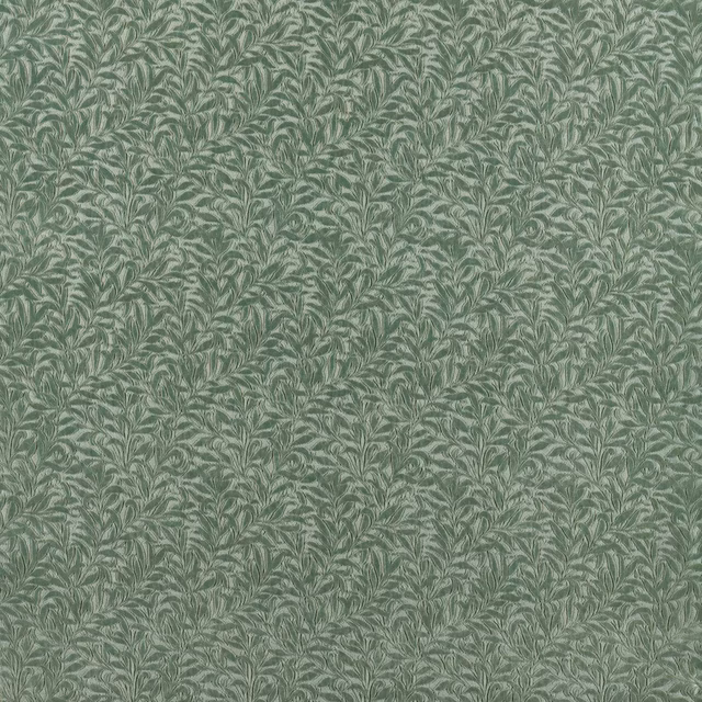 Muted sage-grey velvet with densely repeated pale leafy boughs and subtle pile sheen