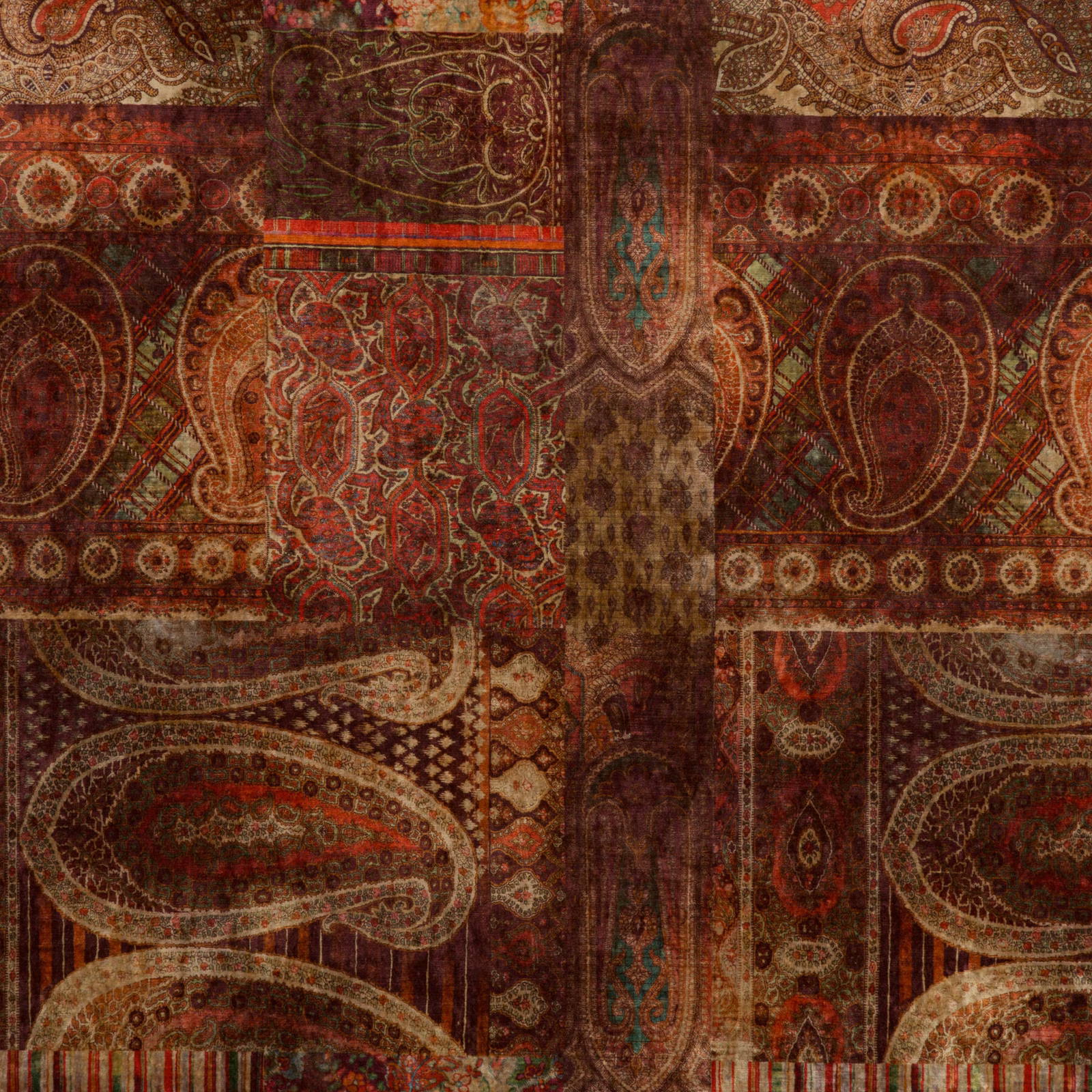 Deep red-plum velvet with ornate paisleys, medallions and muted teal details