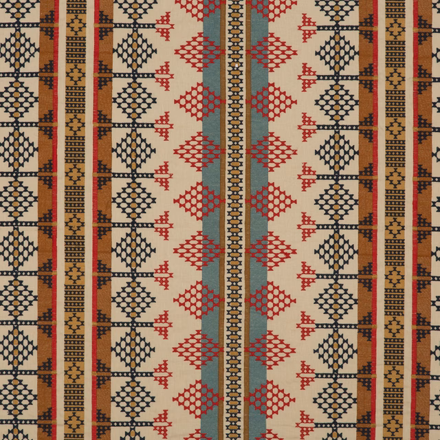 Indigo, red and sand woven fabric with repeating diamond and stripe motifs