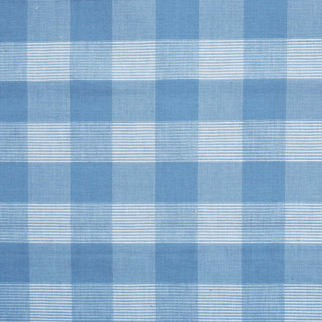 Cool dusty blue cotton check with pale woven lines and textured surface
