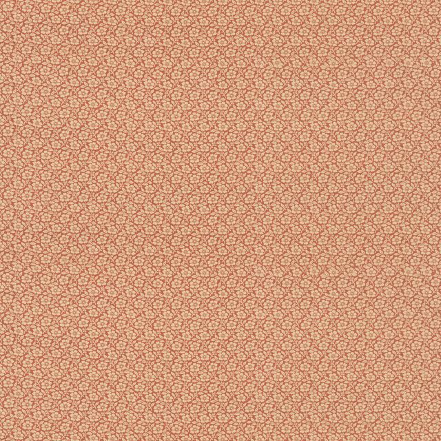 Muted terracotta cotton with tiny red-and-green sprigs on a pale ground