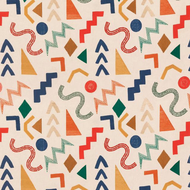 Cream fabric with red, navy, green and ochre geometric motifs