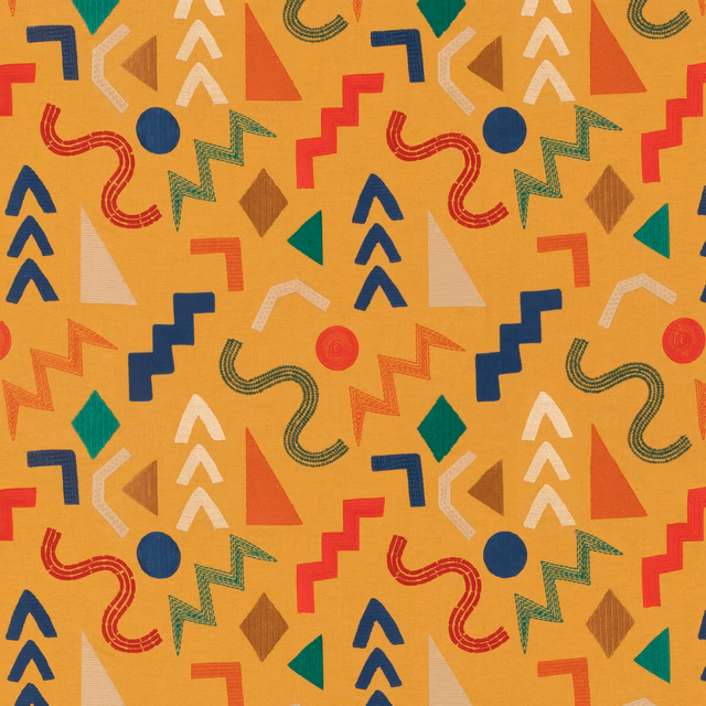 Warm ochre geometric fabric with navy, red, green and cream motifs