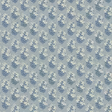 Muted denim-blue wallpaper with repeating cream flower sprigs and slate-blue foliage