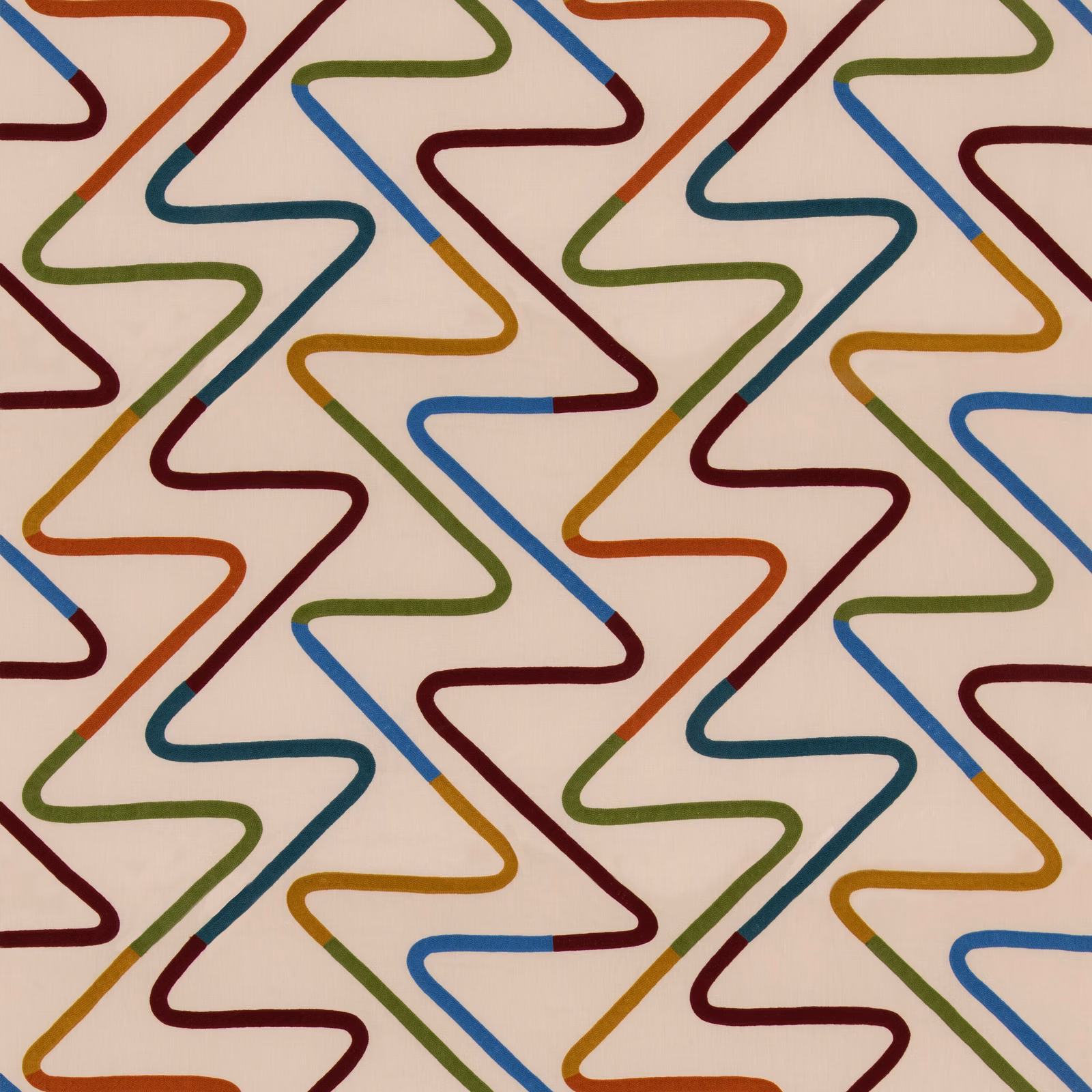 Cream fabric with repeating angular lines in rust, teal, blue, green and ochre