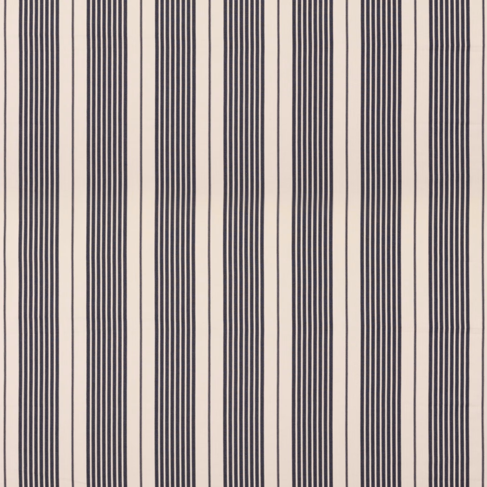 Ivory cotton fabric with varied vertical indigo pinstripes and grouped bands