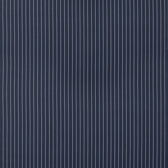 Deep indigo cotton with fine pale vertical pinstripes and a subtle woven texture