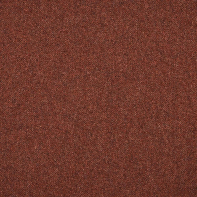 Deep rust-brown textile with a dense, softly mottled and fibrous woven surface