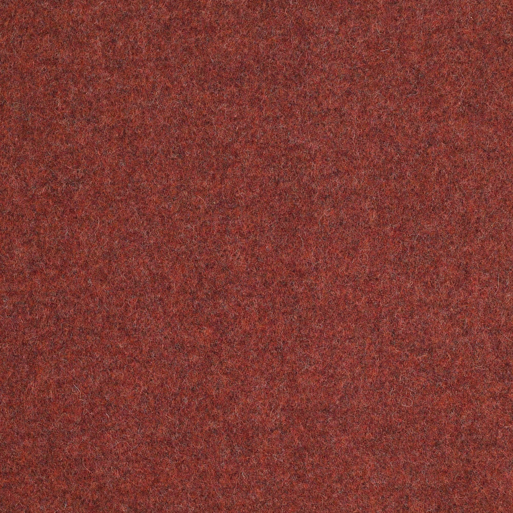 Close-up of mottled rust-red textile with a softly napped, flecked surface