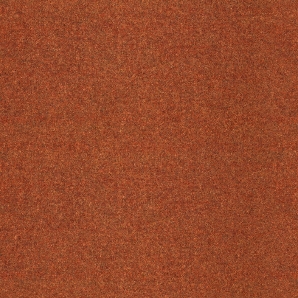 Close-up of mottled burnt terracotta fabric with a soft, napped surface