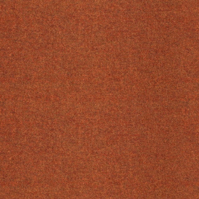 Close-up of mottled burnt terracotta fabric with a soft, napped surface