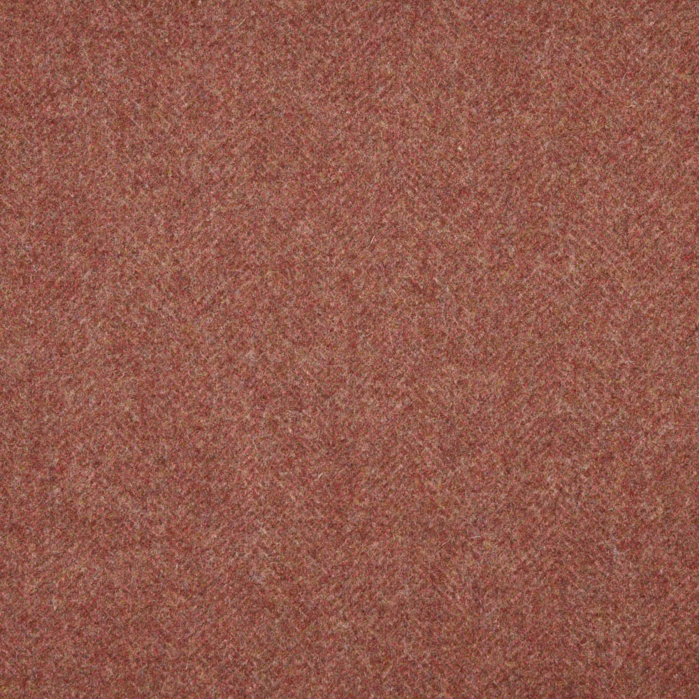 Close-up of dusty terracotta woven texture with fine rust and brown flecks