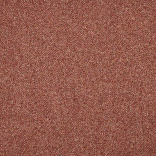 Close-up of dusty terracotta woven texture with fine rust and brown flecks