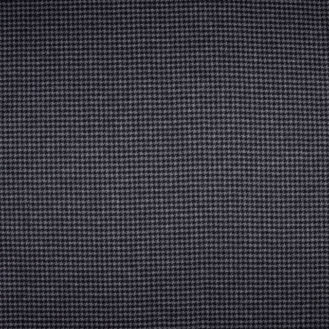 Charcoal-black woven swatch with a tightly packed pale-grey micro-check texture
