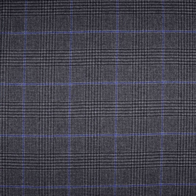 Charcoal grey woven plaid with fine blue windowpane lines and textured surface