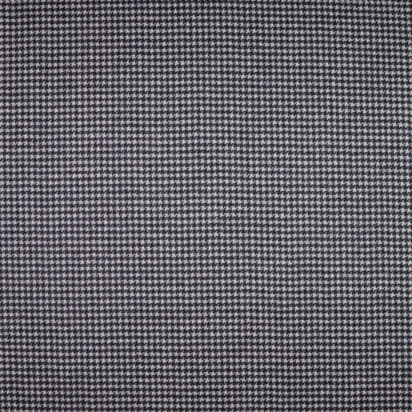 Close view of charcoal-grey micro houndstooth with a dense black and pale grey weave