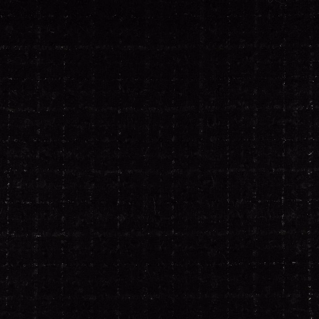Near-black fabric swatch with subtle irregular woven texture and faint charcoal highlights