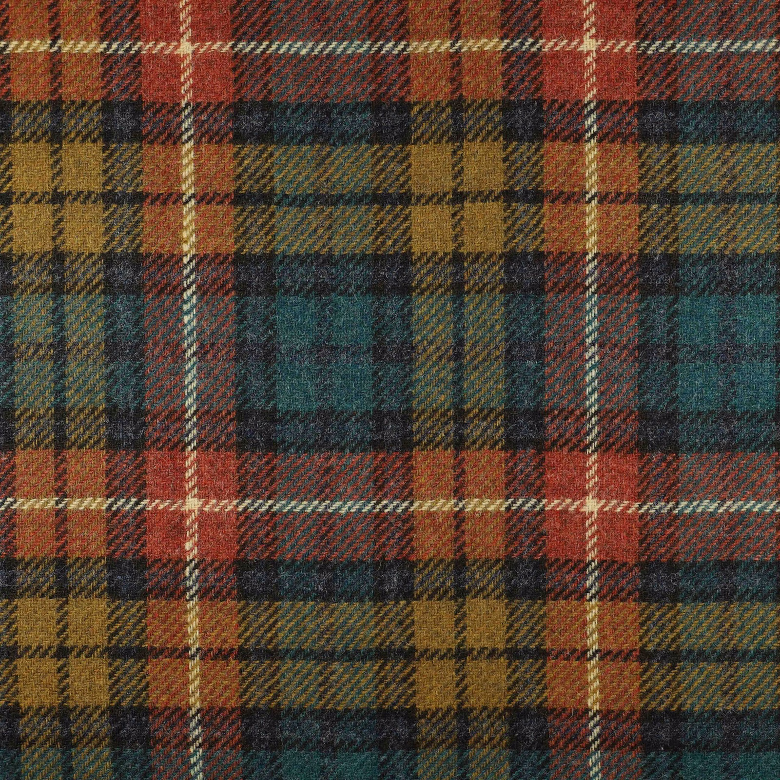 Muted rust, teal, ochre and charcoal woven plaid with diagonal texture