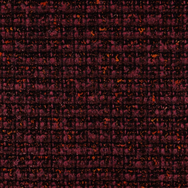 Dark burgundy plum woven textile with red-orange flecks and irregular grid texture