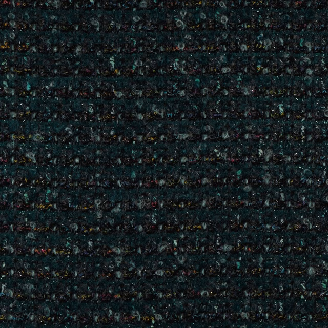 Close-up of dense dark teal woven fabric with horizontal nubs and multicoloured flecks