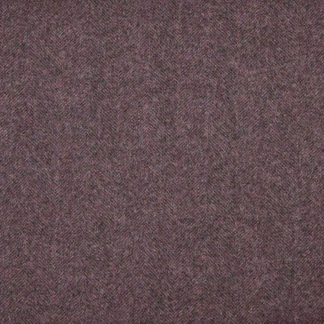 Close view of muted brown-mauve taupe fabric with a fine herringbone weave