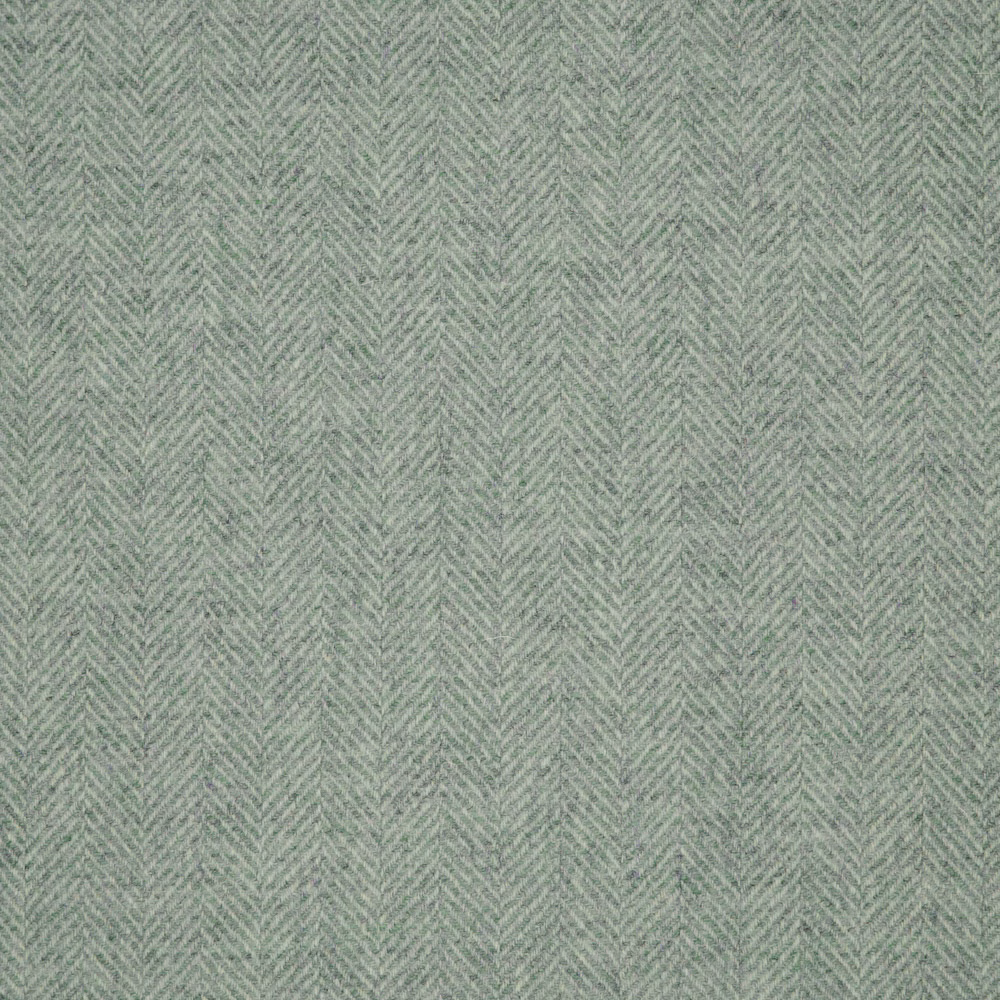 Soft sage-green fabric showing a fine, shadowed herringbone weave