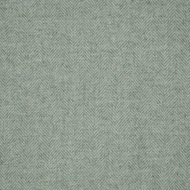 Soft sage-green fabric showing a fine, shadowed herringbone weave