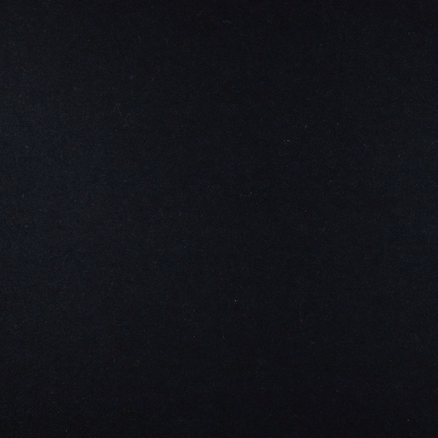 Near-black charcoal fabric swatch with a subtle, low-sheen woven texture