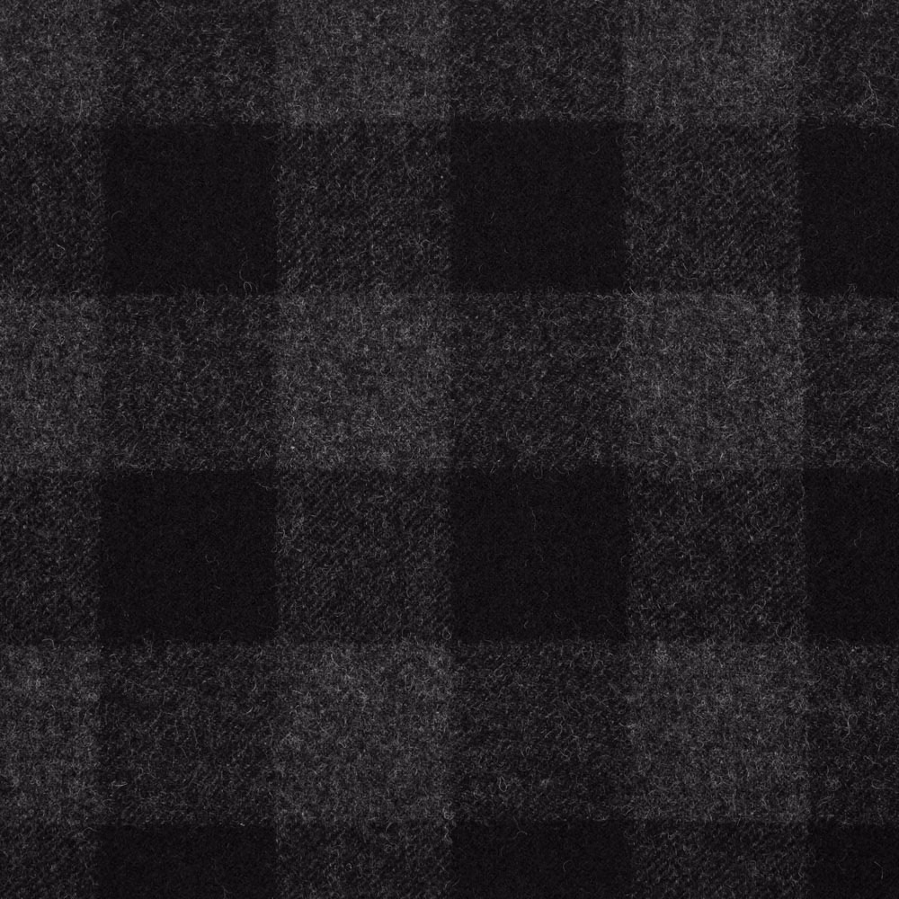 Black and charcoal checked textile with a softly brushed, flecked weave