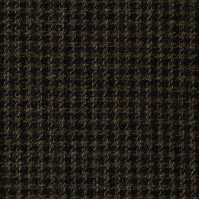 Charcoal-black woven fabric with small bronze, olive and brown textured flecks